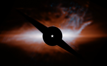 photo showing a large, reddish-orange dust cloud in deep space.