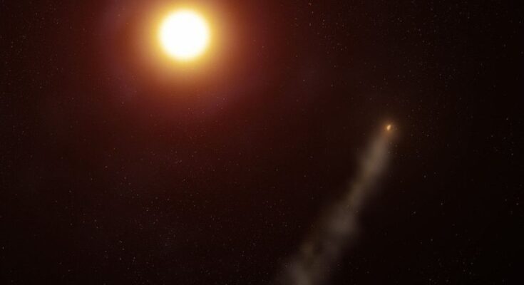 An alien planet trailing a long comet-like tail around red-orange star