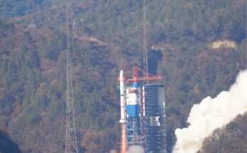 Einstein Probe lifts off behind tree covered hills.