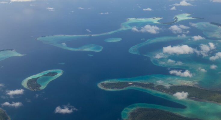 Aerial view photograph of small islands in the Solomon Islands.