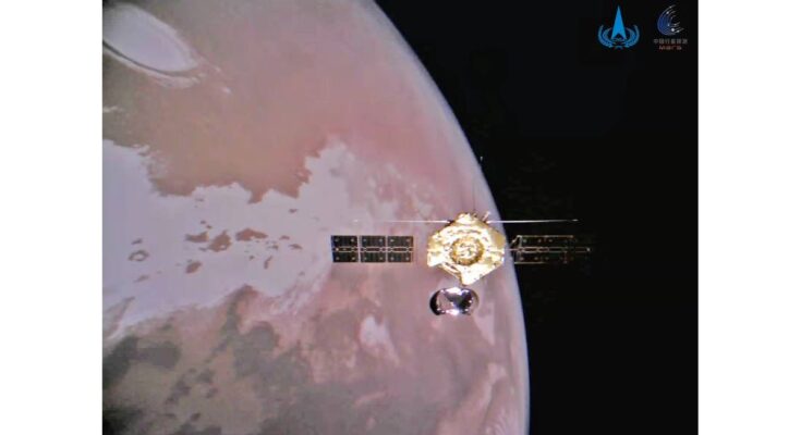 photo of a golden spacecraft in orbit around mars.