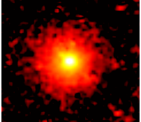 Against a black background is a red circle, which appears fuzzy and slightly pixelated. At the center is a bright area of yellow, and at the center of that is a bright area of white.