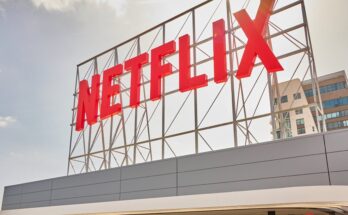 A Netflix sign on top of a building.