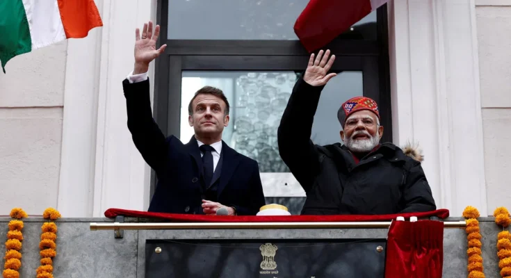 FILE PHOTO: French President Emmanuel Macron and Indian Prime Minister Narendra Modi wave from the balcony during the inauguration of the Indian Consulate as part of a visit in Marseille, France, February 12, 2025. REUTERS/Christian Hartmann/Pool/File Photo