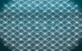 geometric designs form and change in sand on a green background