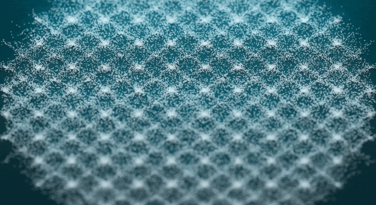 geometric designs form and change in sand on a green background